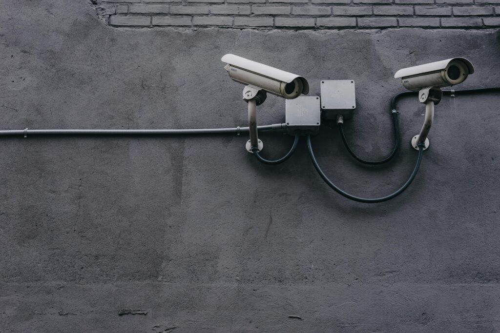 AI Fall Detection in Senior Living Picture of security cameras on a dark wall