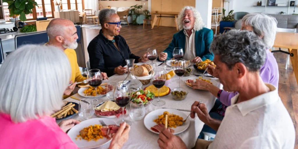 elderly people eating at a table