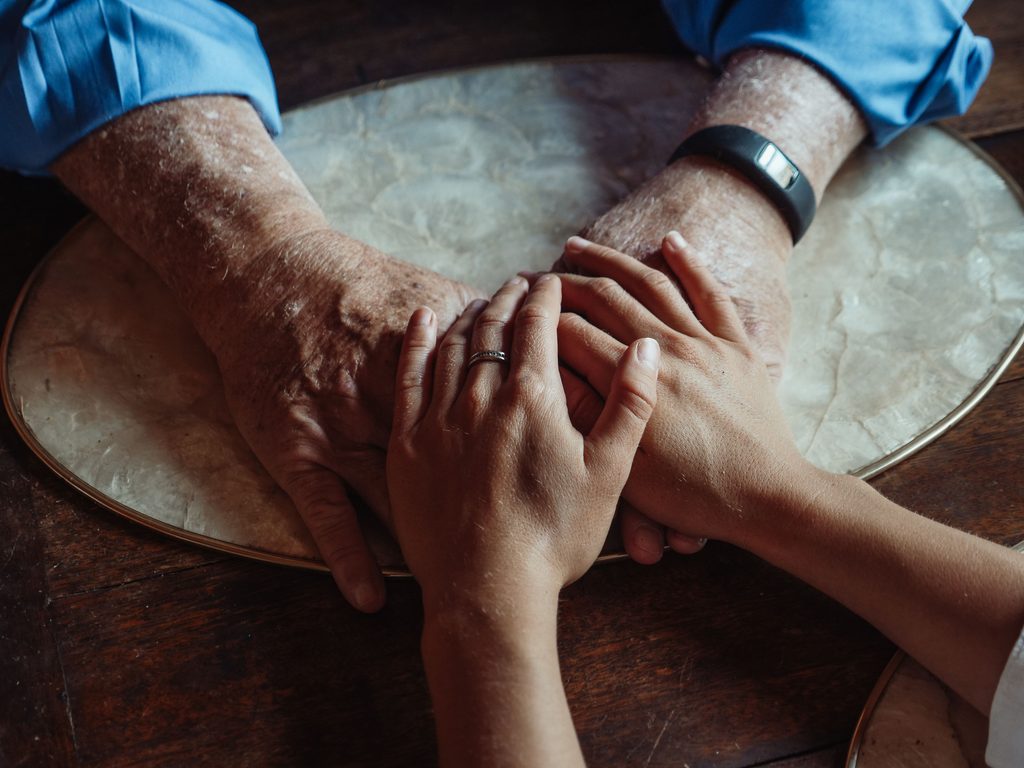 Caregiver Guilt: What to Do About It holding hands across generations