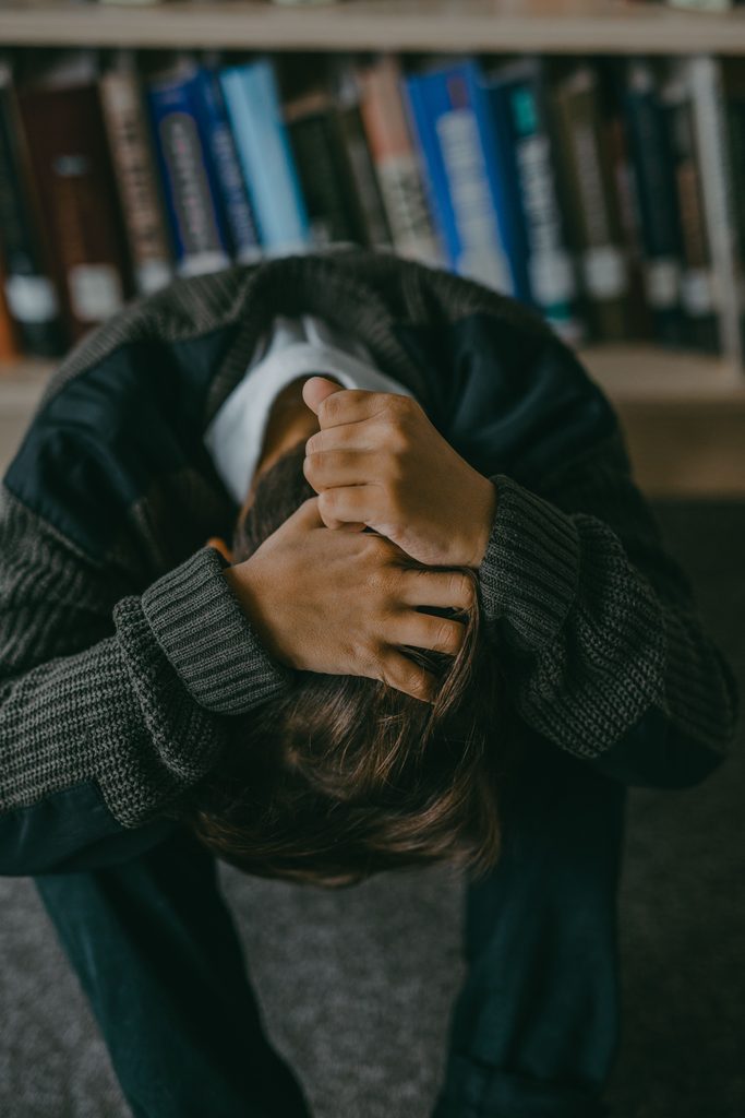 Caregiver Guilt: What to Do About It person with head in hands